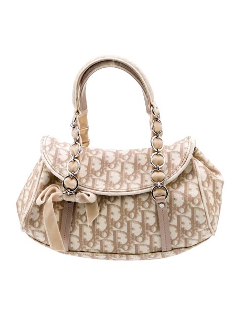 christian dior trotter handbag|Dior romantique bag.